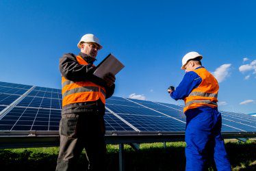 Inspector examination of solar panels